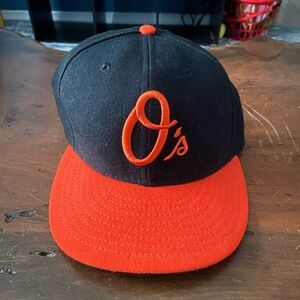 Orioles New Era hat. Size 7 5/8.